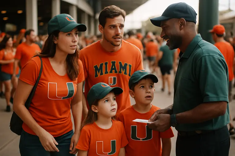 Families and students enter a stadium concourse before a college game